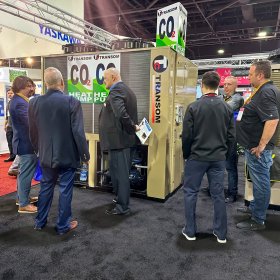 Engineers interested in Transom's CO2 heat pump water heater at the 2023 AHR Expo